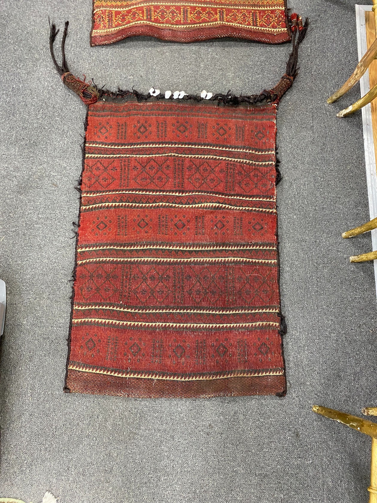 Two Afghan polychrome salt bags, larger 84cm x 48cm.
